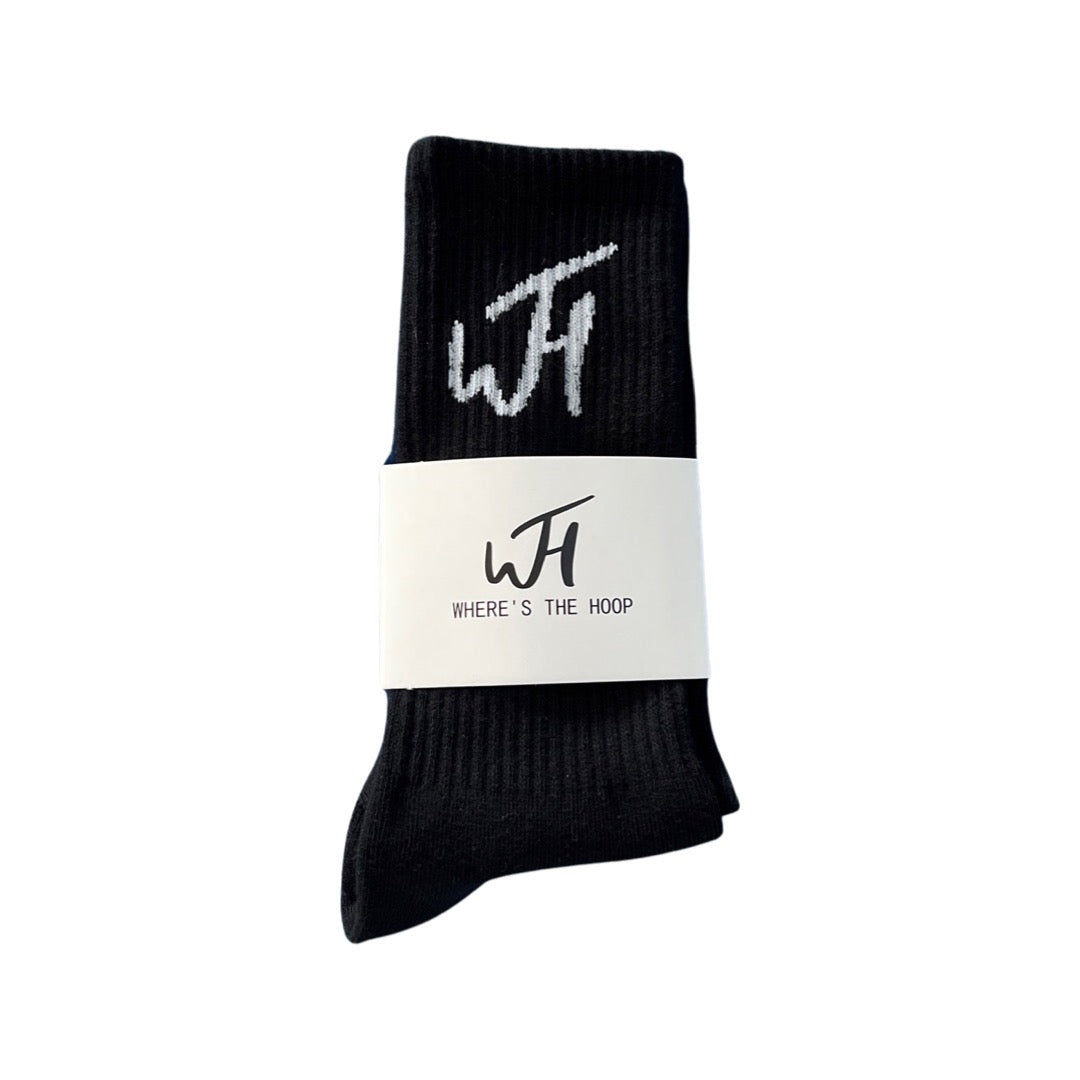 White WTH Logo on black socks folded in packaging