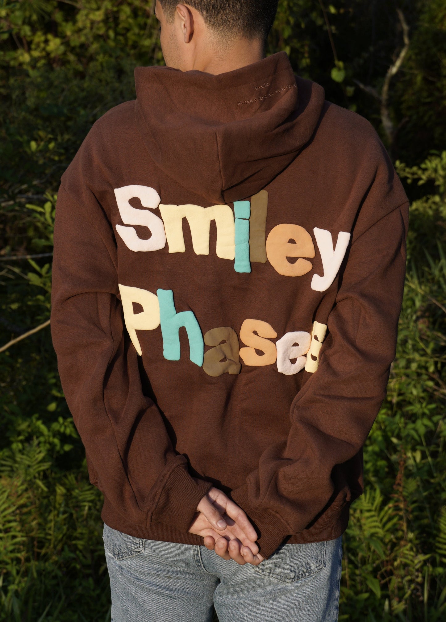 "Smiley Phases" Hoodie - Cosmic Brownie