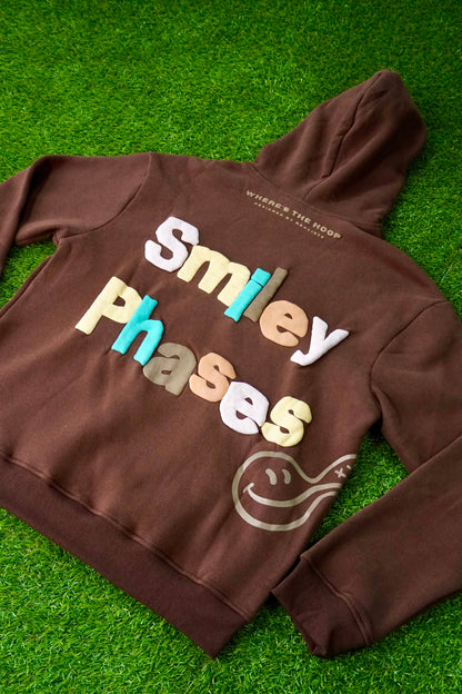 "Smiley Phases" Hoodie - Cosmic Brownie