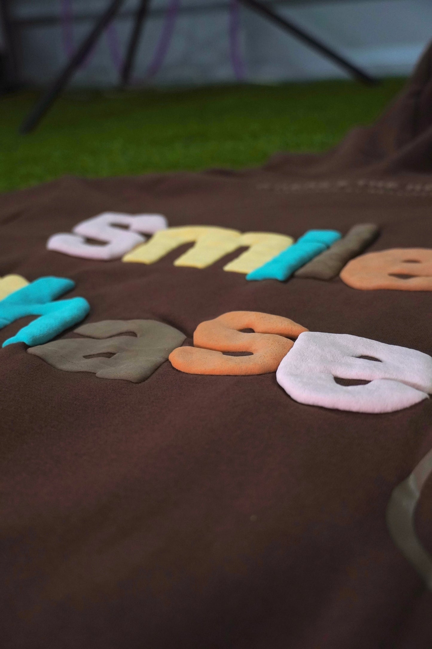"Smiley Phases" Hoodie - Cosmic Brownie